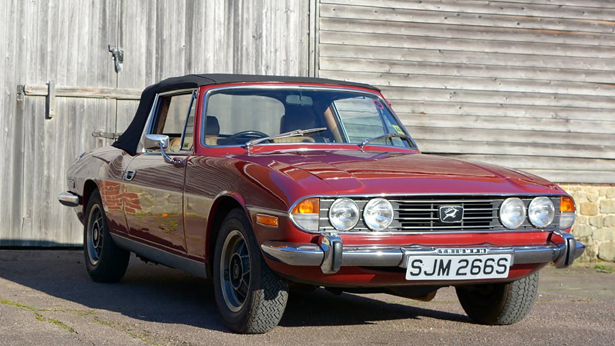 Classic Vintage red Triumph at Country Classic Cars